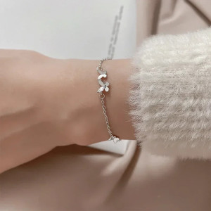 détails Bracelet Papillon Élégance Florale