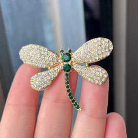 Broche libellule strass aux ailes dorées