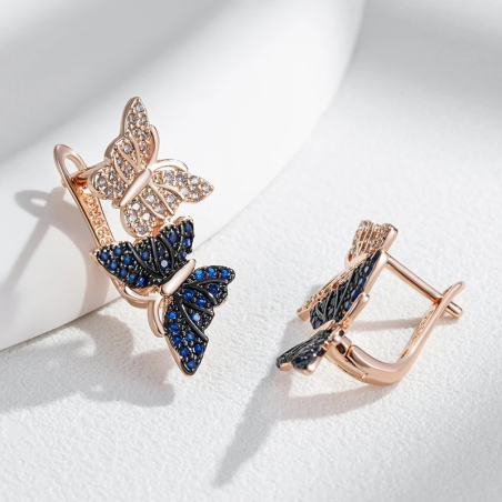 détails Boucles d'oreilles papillon strass bleus et argent
