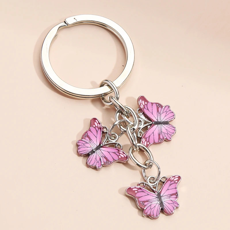 Porte-clés papillon en résine et strass - couleur rose