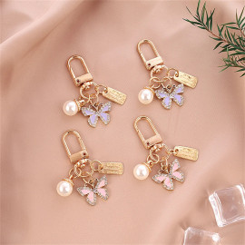 Porte-clés papillon en strass avec perle